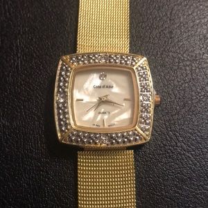 Gold metal watch with crystals
